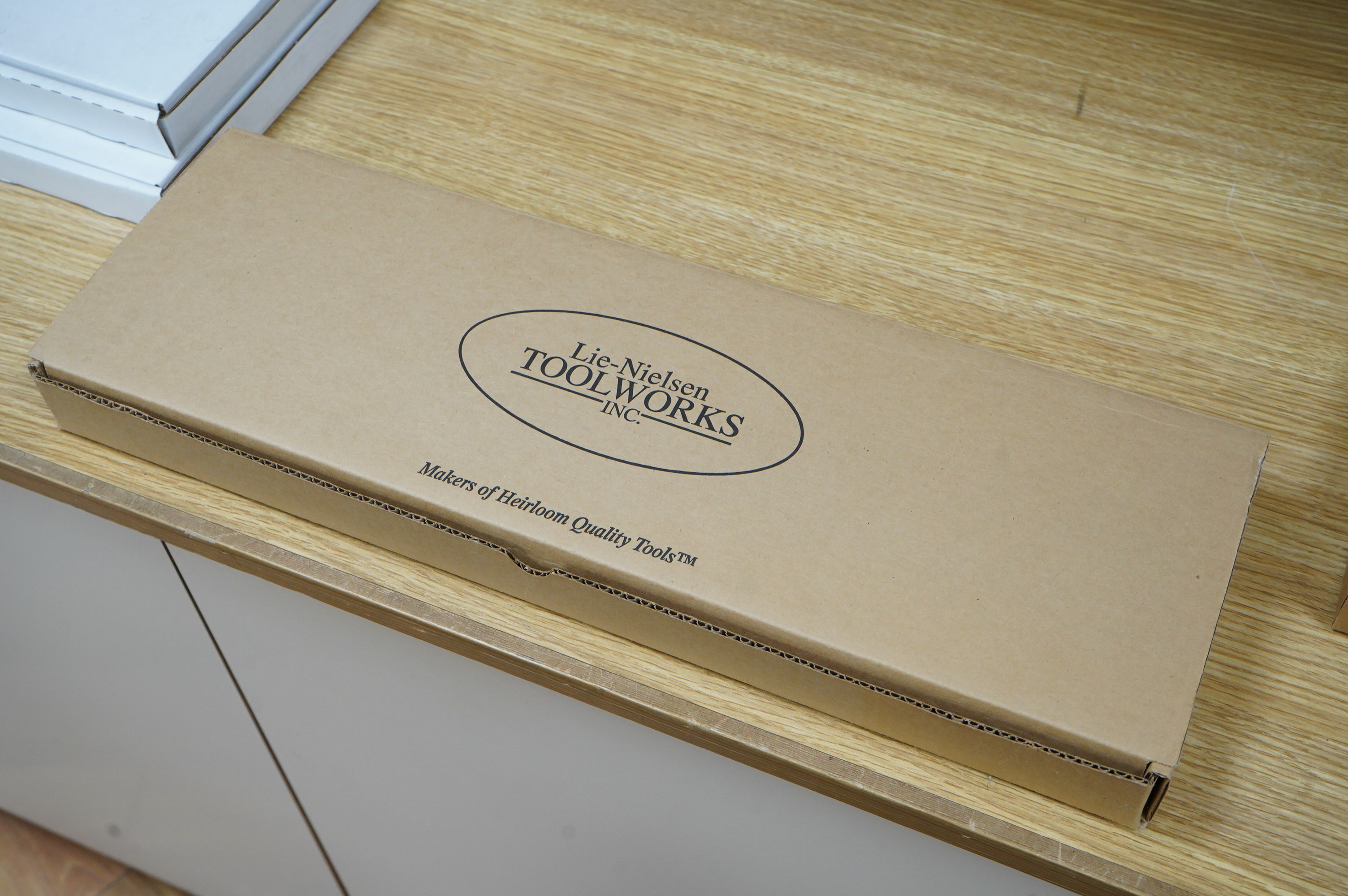 A boxed Lie Nielsen Toolworks 14” tenon saw (rip cut)